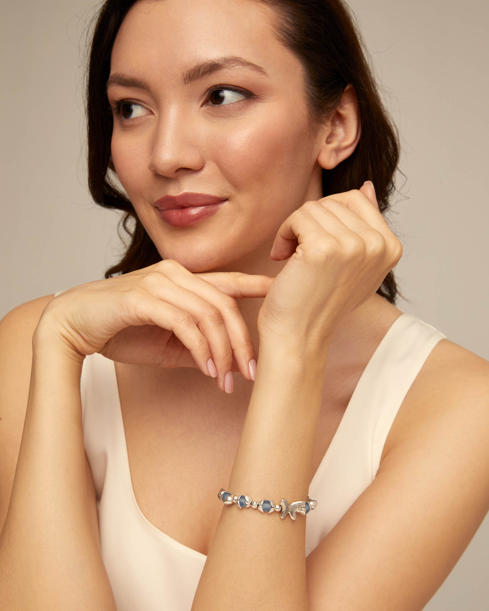 Beaded bracelet with blue crystals and a central butterfly, , large thumbnail